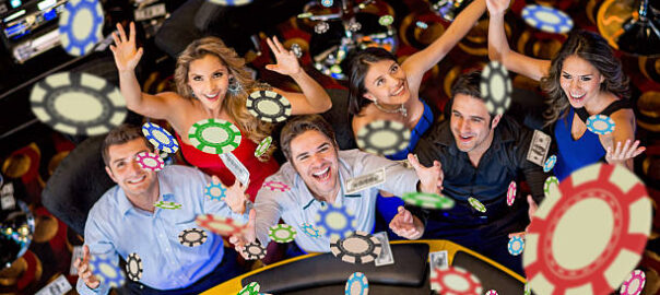 Happy group of people winning at the casino