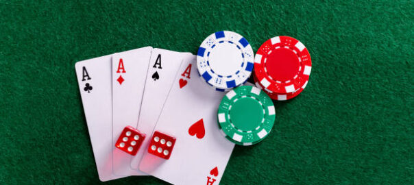 Four aces and gambling chips on the table.