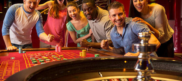 Group Of Friends Playing Roulette In Casino