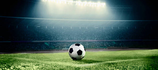 View of soccer ball on athletic field in stadium arena