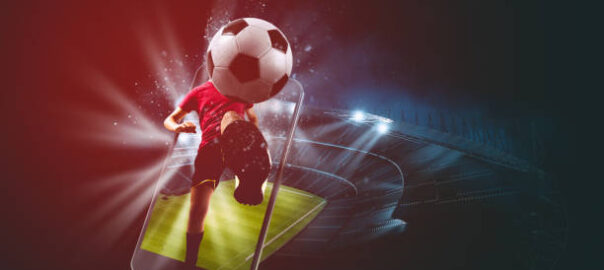 Soccer players, cellphone and ball on a stadium
